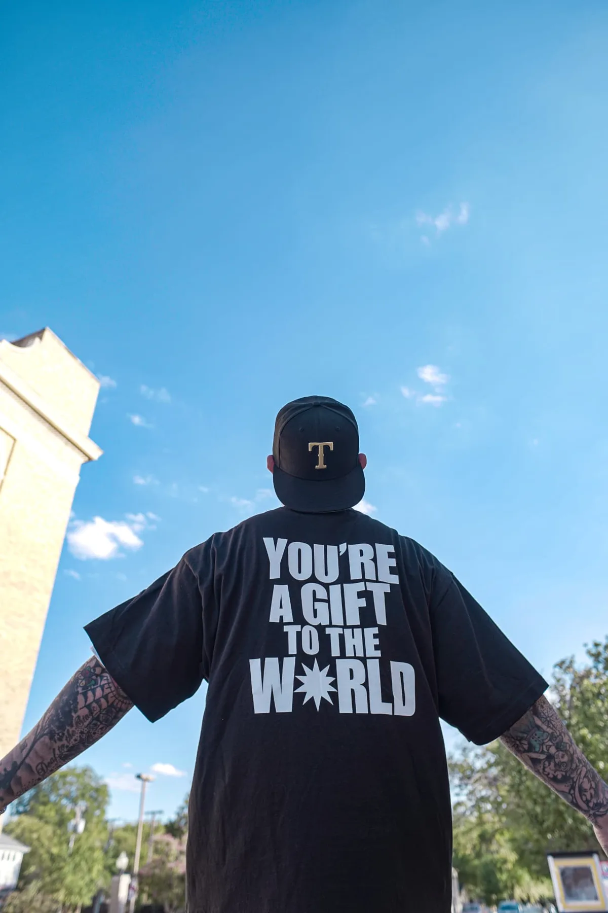 Back of the tee displaying You're a gift to the world